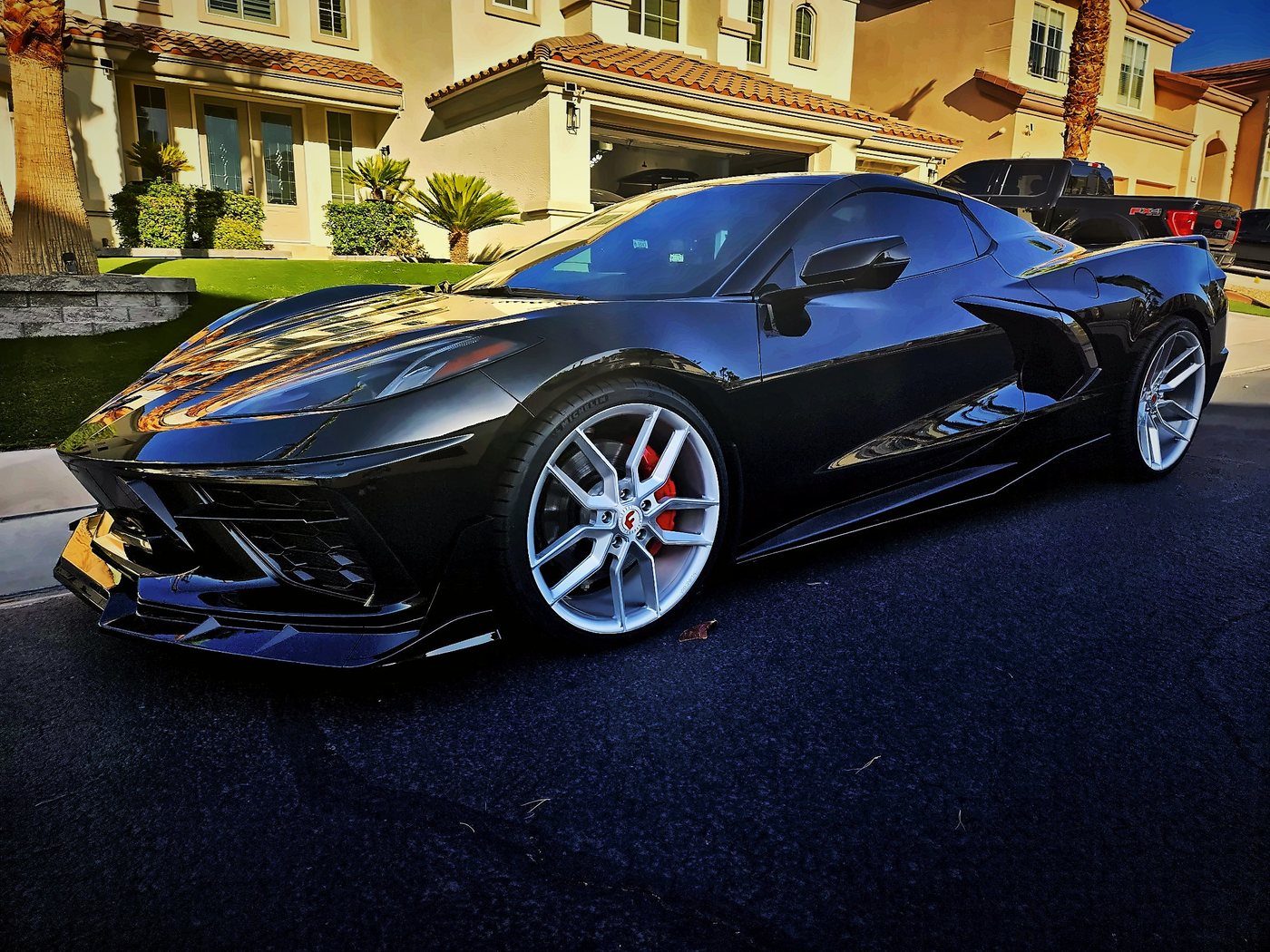 Chad’s black 2021 Corvette Stingray convertible with silver Forgiato wheels and red calipers, parked on a sunny Las Vegas street