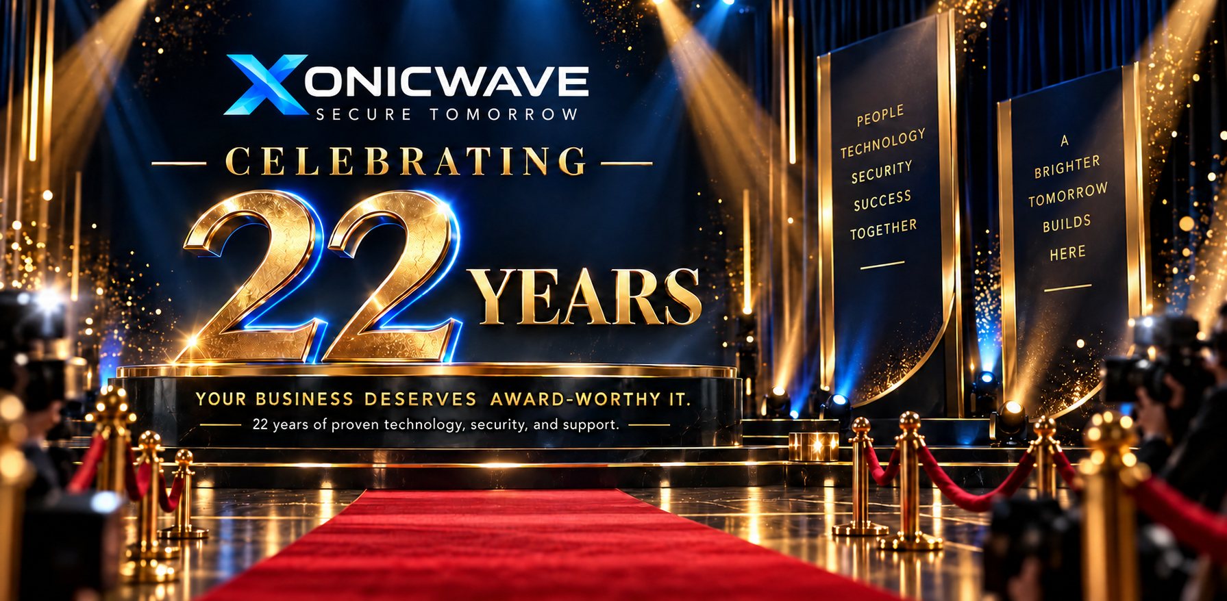 Xonicwave, Secure Tomorrow: celebrating 22 years. Your business deserves award-worthy IT. 22 years of proven technology, security and support. Shown on a gold-lit stage with a red carpet.